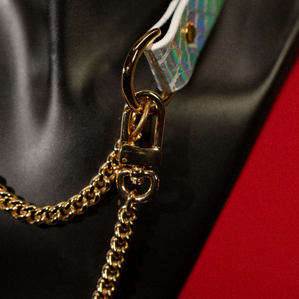 chicchok breathless choker featuring a white textured design with iridescent scales that reflect vibrant rainbow colors
