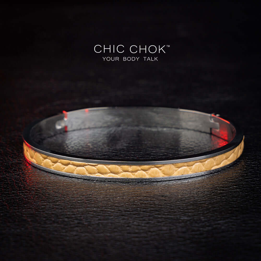 chicchok handcrafted bracelet featuring a sleek stainless steel band with a textured golden leather inlay