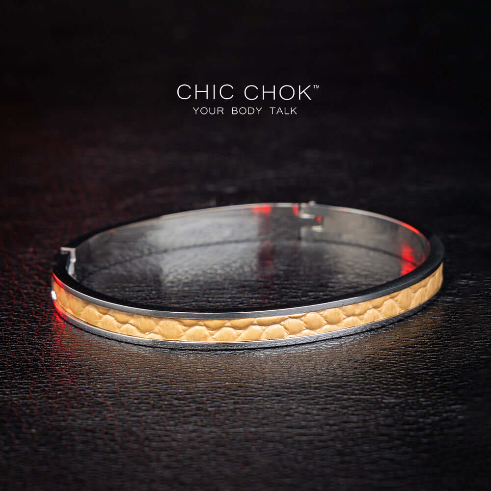 chicchok handcrafted bracelet featuring a sleek stainless steel band with a textured golden leather inlay