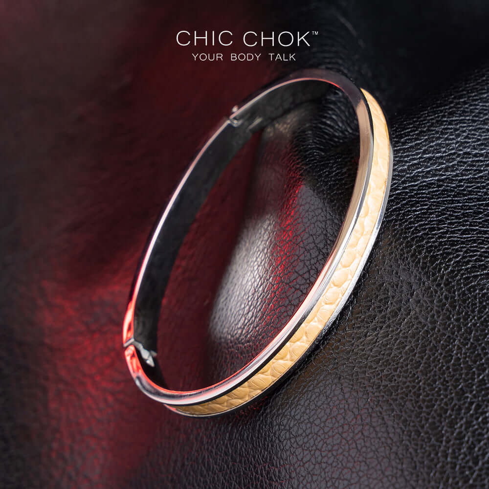 chicchok handcrafted bracelet featuring a sleek stainless steel band with a textured golden leather inlay