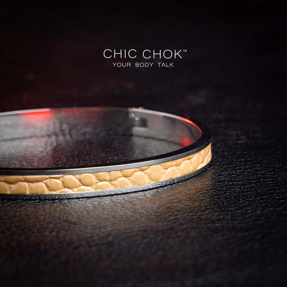 chicchok handcrafted bracelet featuring a sleek stainless steel band with a textured golden leather inlay