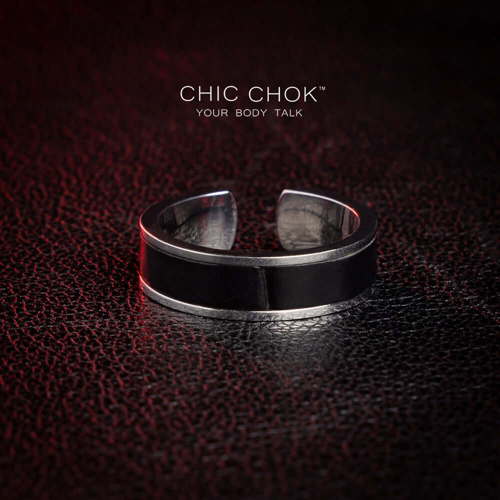 Black-and-silver open ring catalog view showing a broad band and a gap at the back
