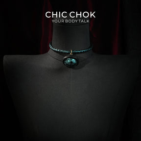 CHIC CHOK The Orchid’s Gaze Teal Snake-Texture Collar with Silent Bell Pendant