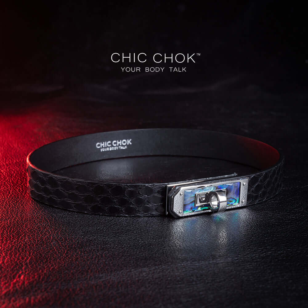 chicchok black python hide collar with green sea shell buckle, featuring a mysterious and mature vibe, luxury textured design for bold fashion statements.