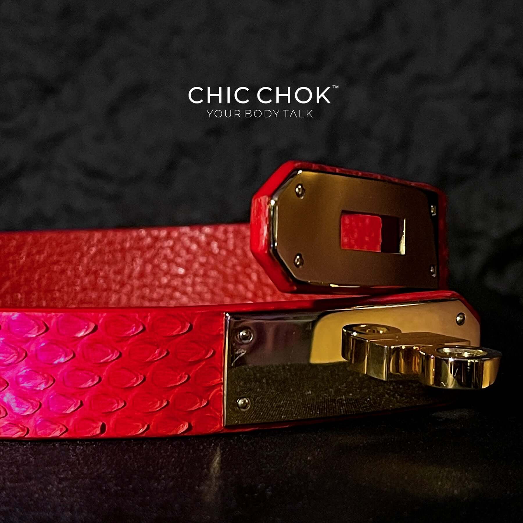 A vibrant red textured leather bracelet featuring a gold-tone stainless steel lock closure, designed by CHICCHOK for bold and luxurious style. Ideal for versatile fashion statements and perfect as a gift.