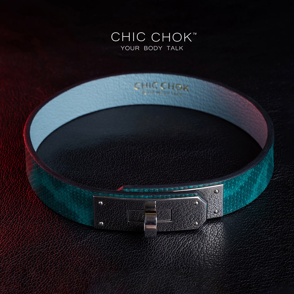 chicchok PoisonIvy Collar CHICCHOK green textured leather choker with a metallic silver locking clasp and light blue inner lining, showcasing luxurious craftsmanship and modern edgy design for bold fashion statements