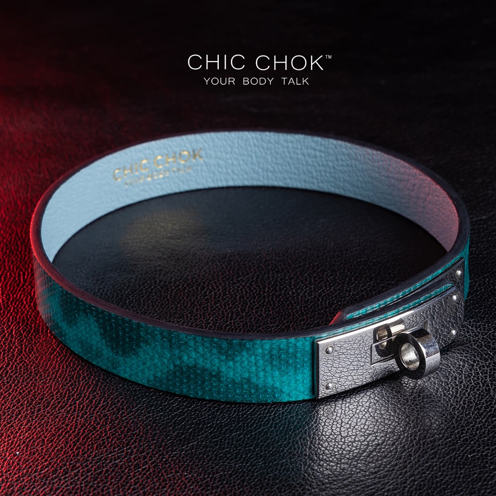 chicchok PoisonIvy Collar CHICCHOK green textured leather choker with a metallic silver locking clasp and light blue inner lining, showcasing luxurious craftsmanship and modern edgy design for bold fashion statements