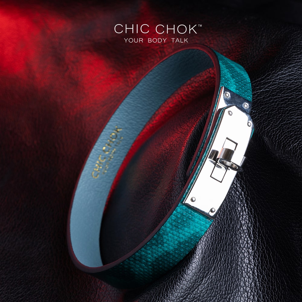 chicchok PoisonIvy Collar CHICCHOK green textured leather choker with a metallic silver locking clasp and light blue inner lining, showcasing luxurious craftsmanship and modern edgy design for bold fashion statements