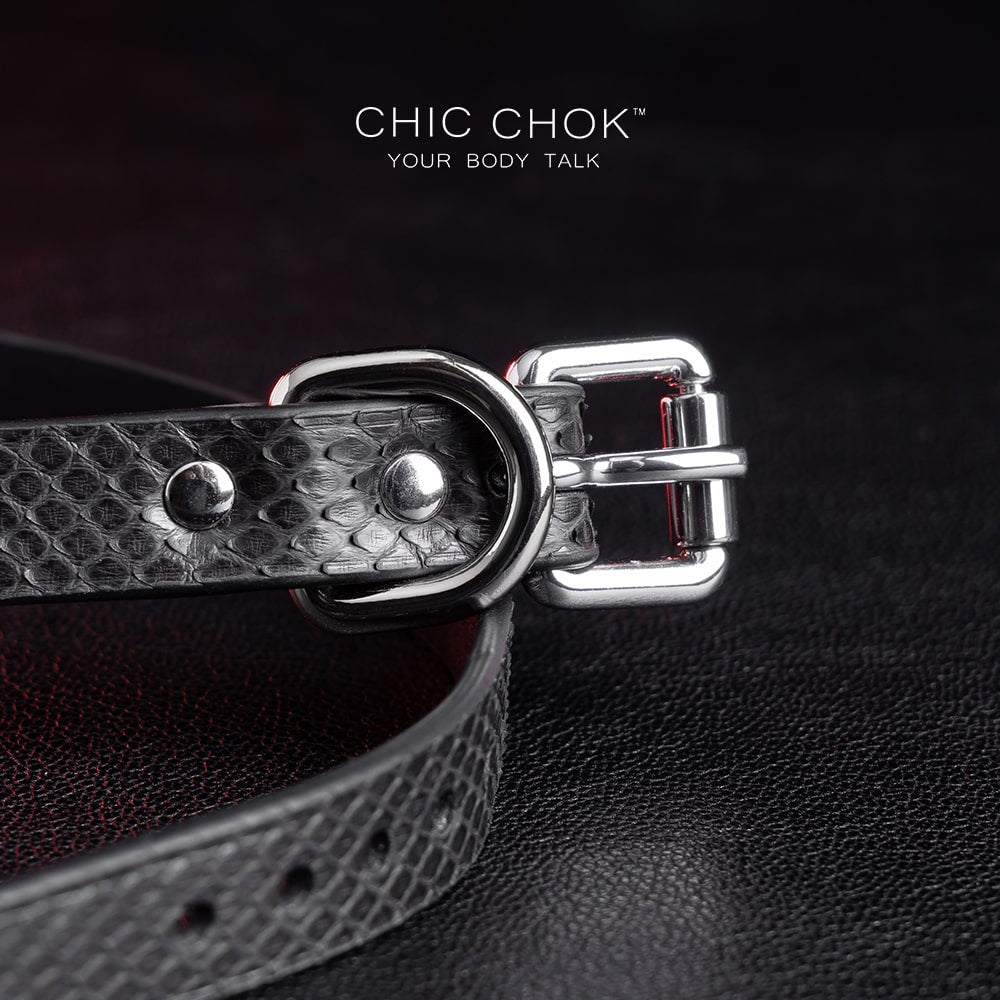 Ring design out of the circle series, predestined relationship, textured python skin given black color more detail and complexity.