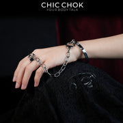 CHICCHOK Shackle Bond Wrist to Finger Chain Bracelet | Gothic Stainless Steel Studded Handcuff Cuff | Subversive Y2K Industrial Punk Crossed Ring Harness Jewelry